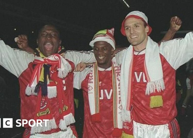 Kevin Campbell (left) celebrates Arsenal's 1991 title win with Paul Davis and Steve Bould