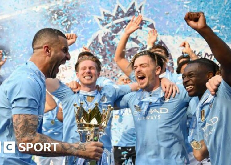 Manchester City lift the Premier League trophy