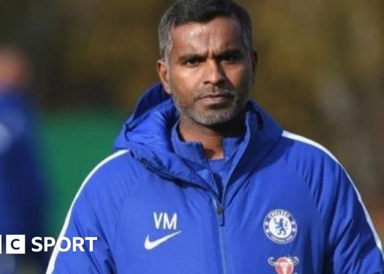 Vinay Menon at Chelsea training wearing a Chelsea jacket