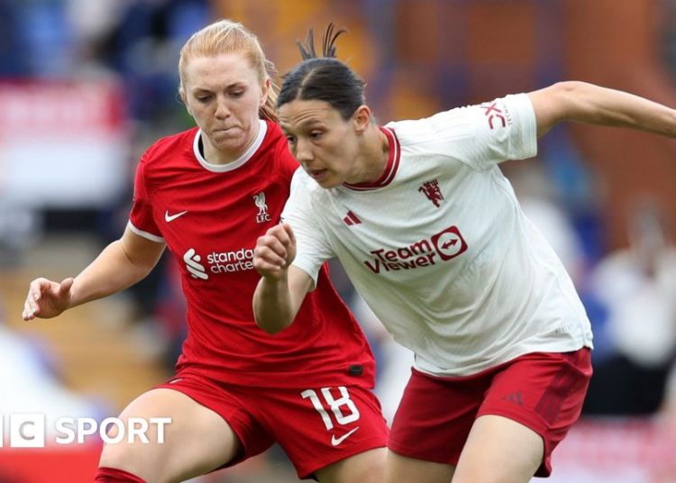 Ceri Holland and Rachel Williams challenge for the ball