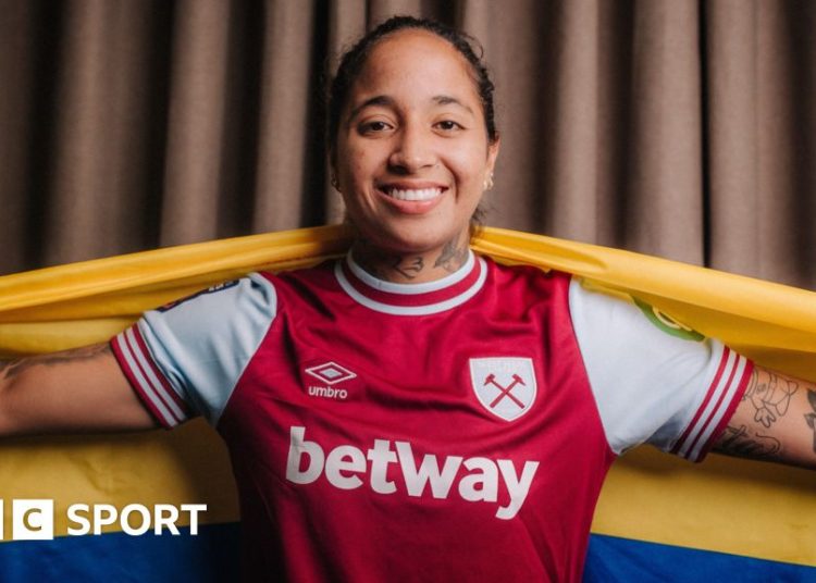 West Ham striker Manuela Pavi poses with Colombia flag after signing for the club