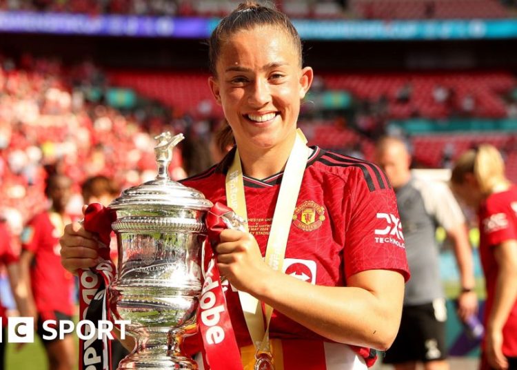 Maya Le Tissier holds the FA Cup