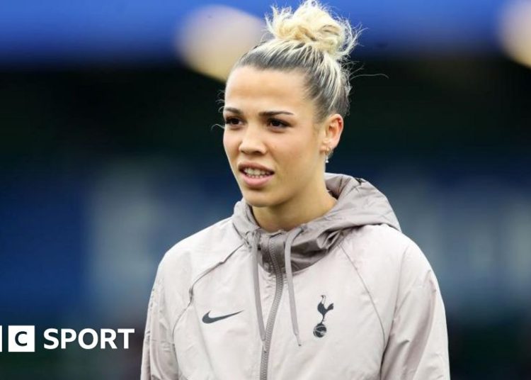 Celin Bizet looks on in a Tottenham top ahead of a game